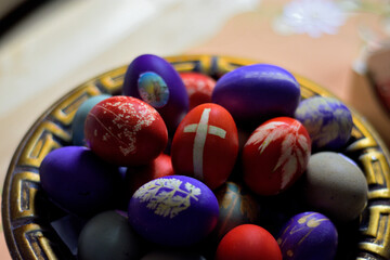 Colorful Easter eggs in a decorative bowl