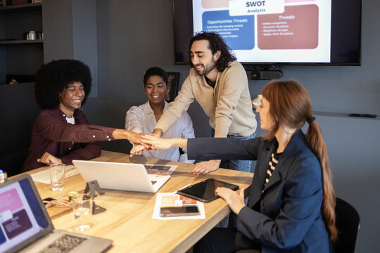 Diverse team collaborating in a modern office setting
