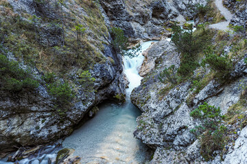 Waterfall flowing through the Gleiersch Gorge near Scharnitz in the Austrian Alps.