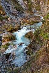 Waterfall flowing through the Gleiersch Gorge near Scharnitz in the Austrian Alps.