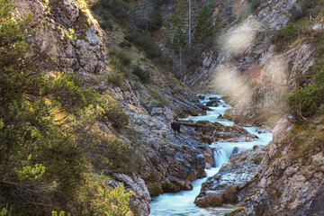 Waterfall flowing through the Gleiersch Gorge near Scharnitz in the Austrian Alps.