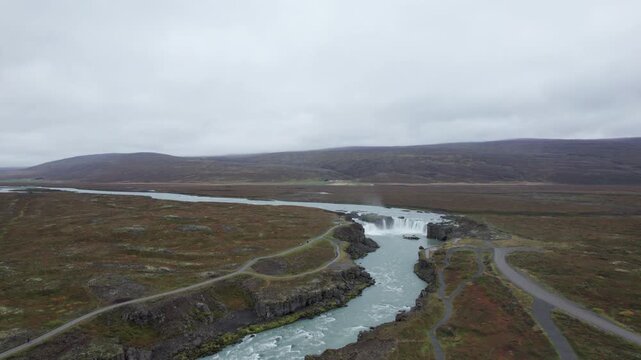 Aerial drone shot flying towards Godafoss Waterfall in northern Iceland