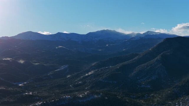 Winter windy snow covered Mount Blue Sky Mt Evans Evergreen Colorado aerial drone sunny blue Front Range Rocky Mountains Witter Gulch Troutdale Village Upper Bear Creek Road Chief Mountain circle left