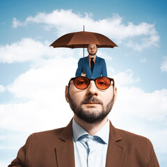 Art collage. Portrait of a man in glasses with a small copy of herself with an umbrella.