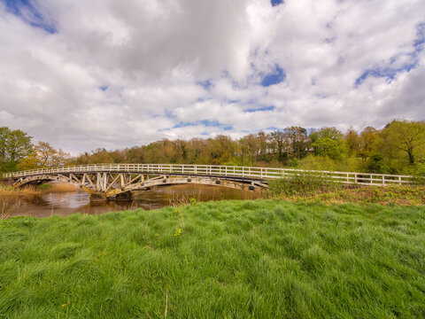 Very large Old wooden packhorse bridge spanning the river weaver, Cheshire, UK
