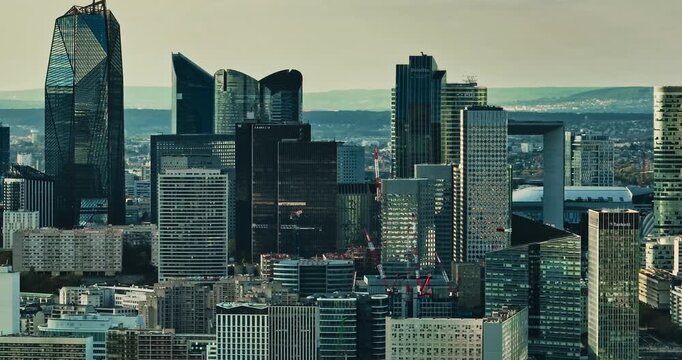 Business district buildings Paris, France. Aerial view of the office windows of a glass skyscrapers. Corporate company head quarter in urban environment. Architectural trends