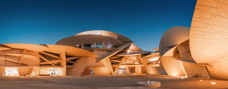 30 November 2025, Doha, Qatar: National Museum of Qatar showcasing its unique Jean Nouvel architecture inspired by the desert rose after sunset