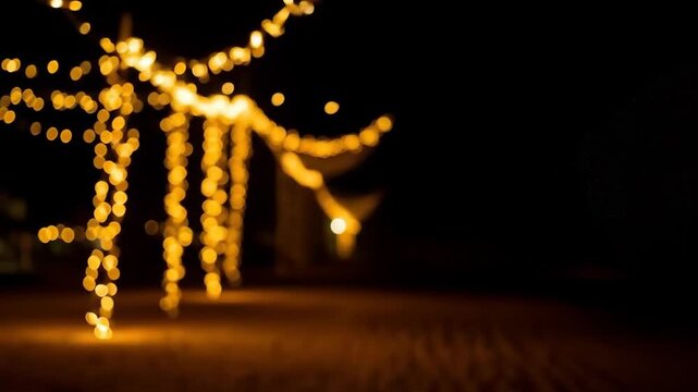 Blurred golden lights illuminating a night scene festive background