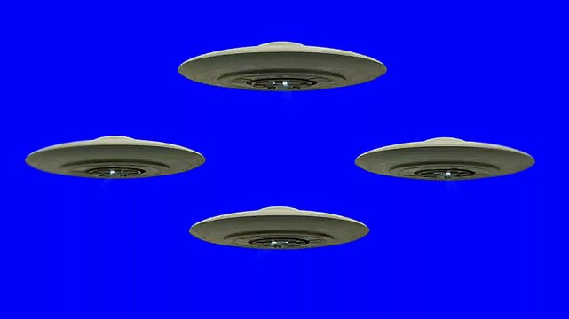 Four Mysterious Flying Discs Hovering in Blue Sky