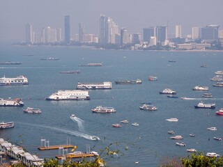 Pattaya Cityscape with Boats on Coastal Waters in Thailand