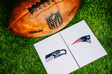 Obraz premium Seattle Seahawks vs. New England Patriots, Super Bowl LX for season 2025, NFL Final, American football championship game at Levi's Stadium in Santa Clara, California. Football Ball on Green Grass