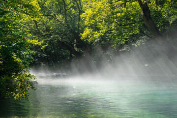 Naklejka premium Voidomatis River, Greece – Crystal Clear Waters in the Heart of Vikos‑Aoös National Park
