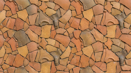 Textured clay surface with various shades of orange and brown, creating rustic appearance