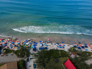 Aerial View of Crowded Beach in Garopaba with Mountains and Atlantic Ocean