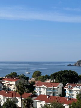 coastal town  with red roof houses and sea view on a clear dae