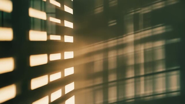 Warm sunlight streams through window blinds, creating a dynamic pattern of light rectangles and long shadows reflecting on a textured interior wall, evoking a tranquil morning or evening atmosphere