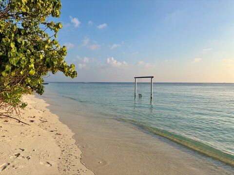 Ukulhas beach Maldives with white sand shoreline and calm turquoise ocean