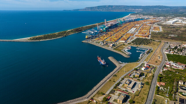 Aerial view of the industrial port of Gioia Tauro, located in the province of Reggio Calabria. It is the largest port in Italy by container throughput and the sixth largest in the Mediterranean Sea.