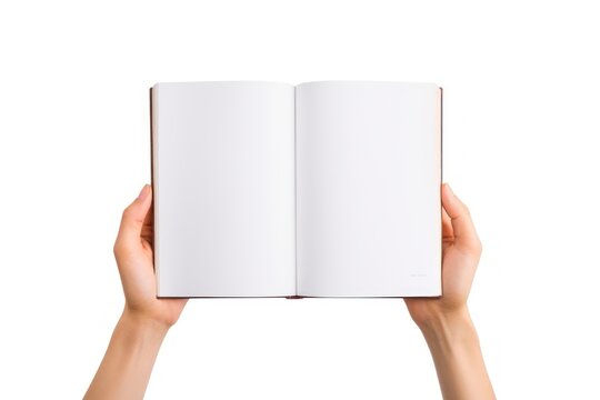 Hand holding opening book publication reading page.