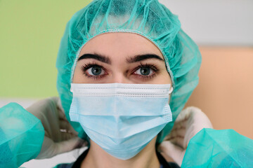 Medical Professional Wearing Surgical Mask and Cap in Clinical Setting for Safety and Care Today