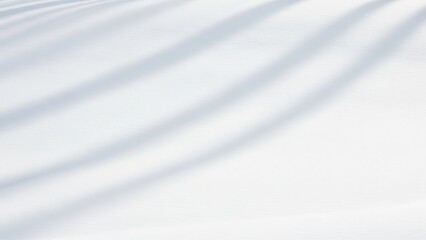 Minimal winter background with soft snow texture, gentle diagonal shadows, clean white surface, calm and airy atmosphere