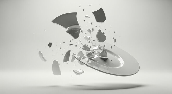 White ceramic plate smashing into pieces in mid-air explosion