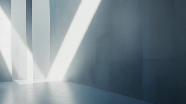 Minimalist interior space featuring clean white walls and floor, illuminated by sharp diagonal beams of natural light creating geometric shapes and a sense of depth and openness