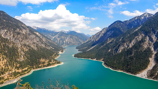 Lake Plansee near Reutte with turquoise water and an alpine mountain backdrop.