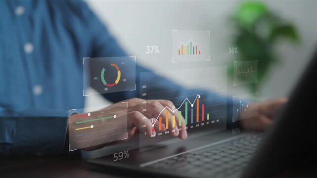 Businessman hands using laptop with virtual financial data screen, analyzing stock market charts and digital dashboard. Professional concept for business intelligence, data analytics and growth.