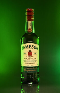 A bottle of Jameson whiskey is shown in a green background
