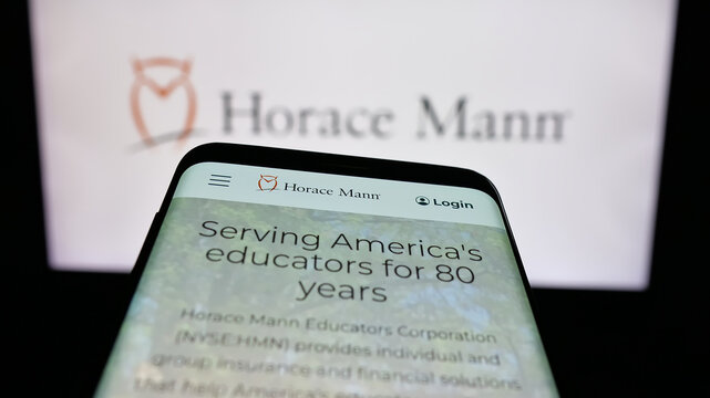 Stuttgart, Germany - 01-16-2026: Mobile phone with website of US company Horace Mann Educators Corporation on screen in front of logo. Focus on top-left of phone display.
