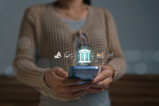 Conducting financial transactions and investments on online platforms with modern and secure technology, the young woman used her mobile phone to activate credit card notifications.