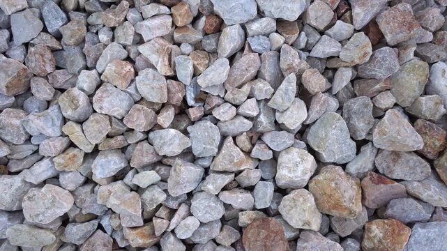 Close-up video of a pile of crushed limestone, a material for road construction.