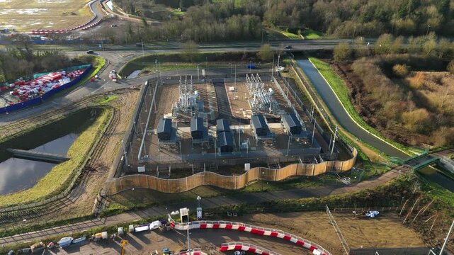 Aerial Drone View of an Electrical Substation with Powerlines and Pylons Supplying Energy to the Waltham Cross Data Center in Hertfordshire UK