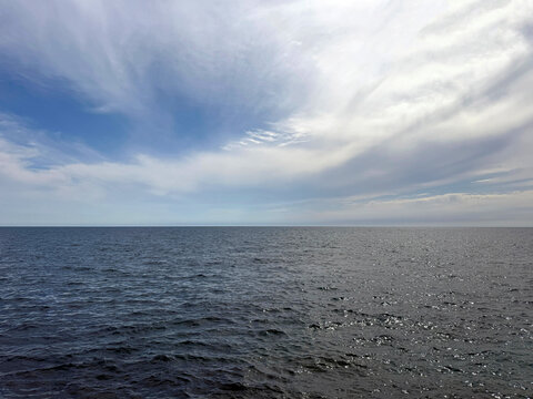 Open sea glittering waves and sky.