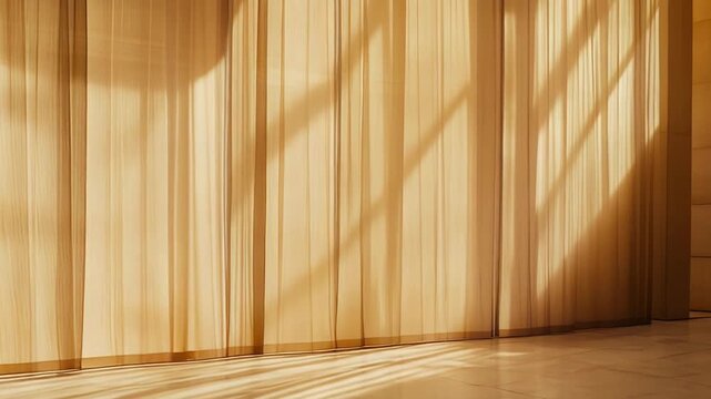 Sunlight streams through translucent window coverings, casting strong diagonal shadows on the beige fabric and reflecting long, soft patterns onto the polished floor tiles in an empty room