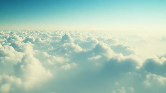 Capturing a serene aerial perspective from above, a vast expanse of white cumulus clouds blankets the horizon under a clear blue sky, evoking feelings of peace, freedom, and tranquility