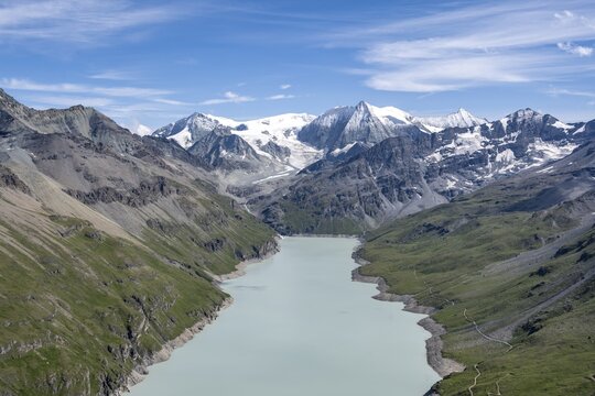 Blue mountain lake in a mountain landscape with glaciers, Lac des Dix reservoir and Mont Blanc de Cheilon peak, Valais Alps, Valais, Switzerland