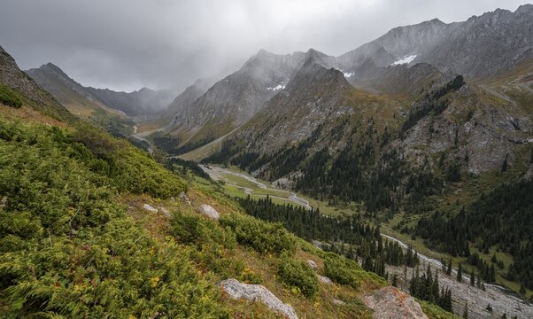 Green mountain valley with river and steep mountain peaks, Chong Kyzyl Suu Valley, Terskey Ala Too, Tien-Shan Mountains, Kyrgyzstan