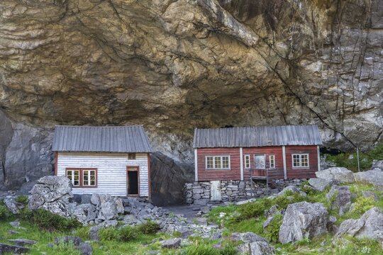 Helleren, houses under rock face, J&oslash;ssingfjord, Sokndal, Rogaland, Norway