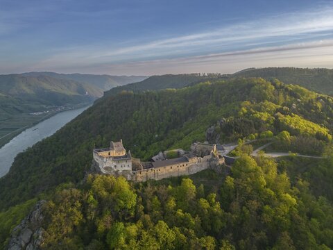 Drone shot of Aggstein Ruin at sunrise with Danube, Wachau, Sch&ouml;nb&uuml;hel-Aggsbach, Lower Austria, Austria