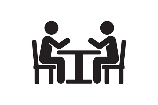 Two people sitting at table talking silhouette icon representing business meeting or dinner date