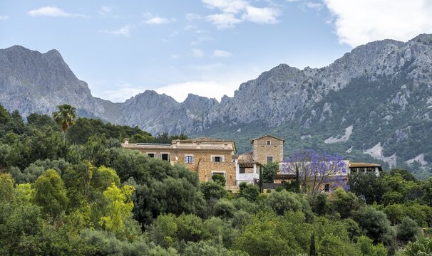 Typical houses of the mountain village Binibass&iacute;, view of rocky mountains, hiking trail from Soller to Fornalutx, Serra de Tramuntana, Majorca, Balearic Islands, Spain