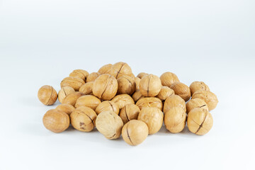 The paper-covered walnuts are placed on a white background.