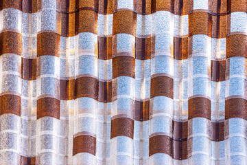 Glass tile with shifting interplay of light and shadow  