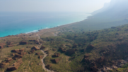 Aerial View of Coastal Landscape with Mountains and Ocean © M