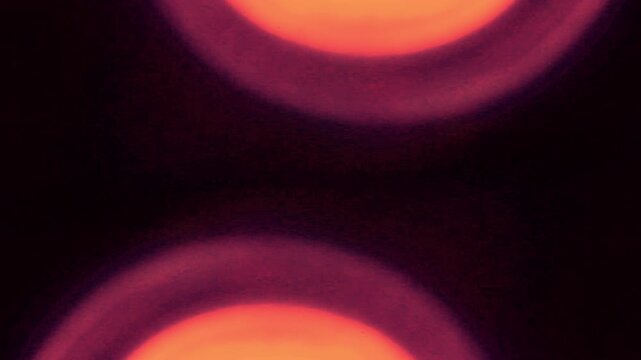 Glitch Film Burn Transition, Abstract orange shapes drift across a dark frame