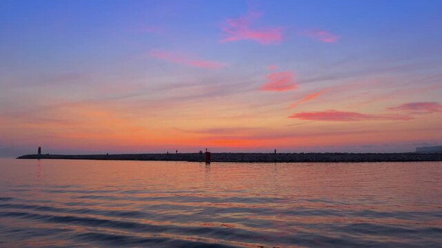 Denia sunrise over Cape San Antonio calm Mediterranean sea