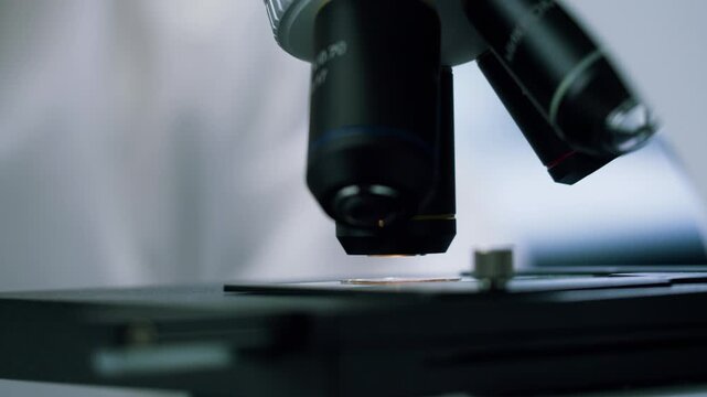 Engineer doctor working with microscope in laboratory, Scientific laboratory with various research equipment, man conducting experiments and research, Science and technology concept.