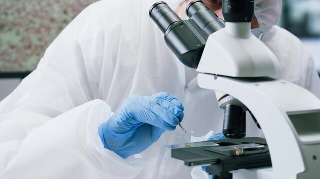 Engineer doctor working with microscope in laboratory, Scientific laboratory with various research equipment, man conducting experiments and research, Science and technology concept.
